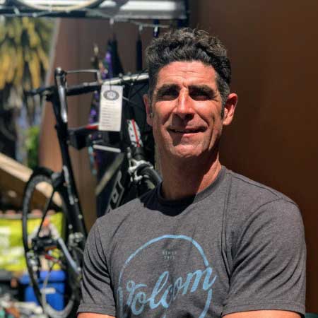 man by bike shop